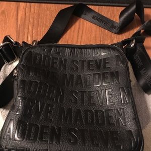 A black crossbody purse.